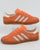 Adidas Gazelle Indoor Trainers in light orange