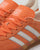 Adidas Gazelle Indoor Trainers in light orange
